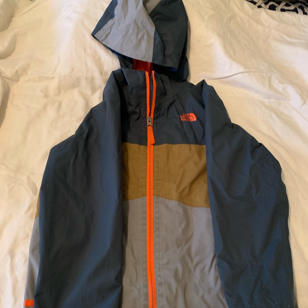 Size 10-12 boys North Face rain jacket.